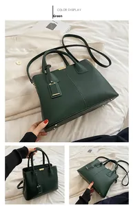 Detail of dark green lychee pattern tote bag with gold logo and detachable strap