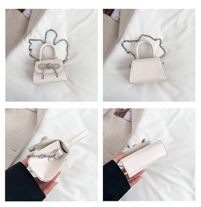 Detail views showing cream mini bag with crystal bow, chain strap and interior space