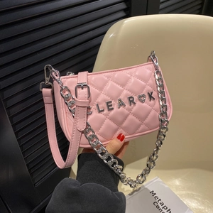 Pink quilted leather crossbody bag with chain strap and heart letter charm