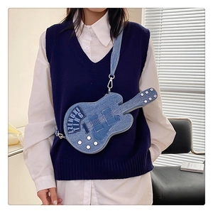 Detail of unique guitar-shaped denim crossbody bag with adjustable shoulder strap