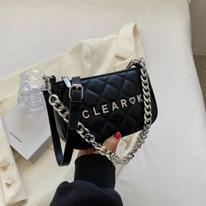 Black quilted leather crossbody bag with silver chain and CLEAR heart metal logo