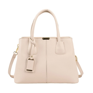 Detail of cream leather handbag showing double stitching and golden metal buckle