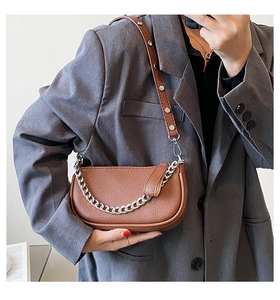 Brown lychee leather shoulder bag with silver rivet strap and decorative chain