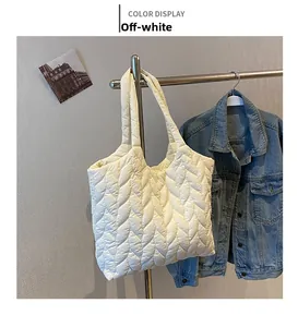 Detailed cream quilted tote bag with wave-pattern stitching and large capacity