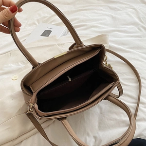 Chic mocha leather handbag for women featuring a large capacity interior and dual handles