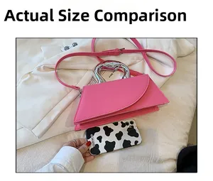 Pink PU leather crossbody bag with geometric flap and silver metal hollow handle