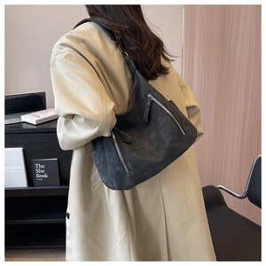 Detailed back view of a dark gray retro hobo bag with sleek side metal zippers