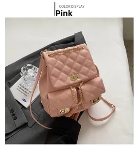 Detailed view of pink quilted PU leather mini backpack with golden chain and buckles