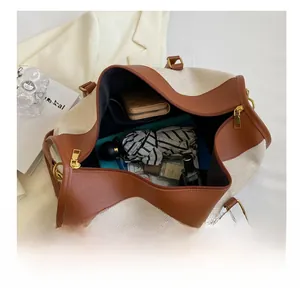 Interior view showing the large capacity of the canvas tote bag with daily essentials