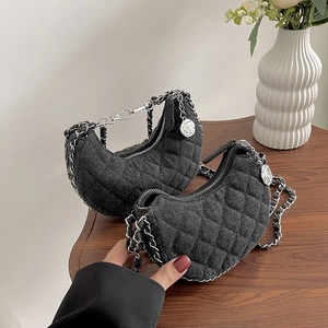 Quilted denim crescent hobo bag with silver chain strap and rose charm detail
