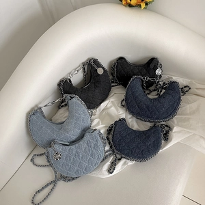 Quilted denim crescent bags in three colors with silver chain straps and floral charms