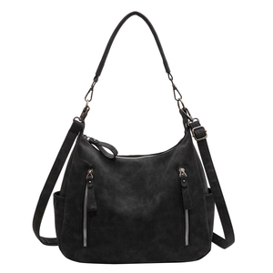 Retro black tote bag in matte faux leather with dual front zippers and adjustable strap