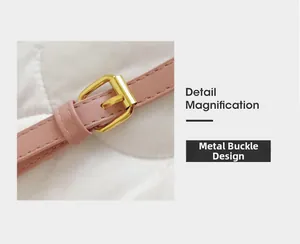 Détail de la bandoulière en cuir rose avec une boucle en métal doré poli brillant