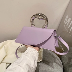Lavender purple handbag with fluid silver handle and asymmetric flap design