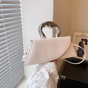 Minimalist cream leather handbag with liquid silver metal handle and shoulder strap