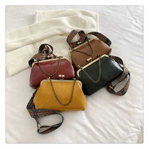 Detailed top view of retro doctor bags with vintage kiss-lock and dual straps set