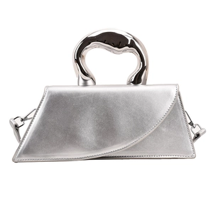Minimalist silver handbag with unique artistic metal handle and asymmetric trapezoid design