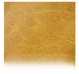 Detailed close-up of premium brown lychee pattern leather texture on a shell bag