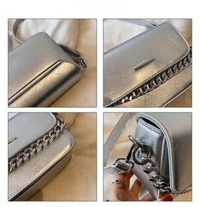 Detailed views of silver chain crossbody bag showing metal buckle and wrinkled texture