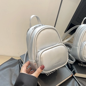 Mini silver metallic backpack for women with front zipper pocket and fashion text