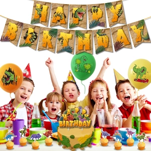 Close-up of dinosaur birthday party set with banners, balloons and themed cake toppers