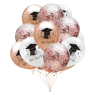 Rose gold graduate balloon set with We Did It slogan and graduation themed icons
