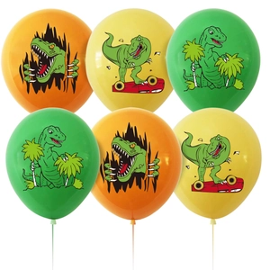 Detailed view of colorful dinosaur printed latex balloons in orange, yellow, and green