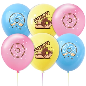 Close-up of colorful donut theme party balloons with cartoon prints and hanging strings