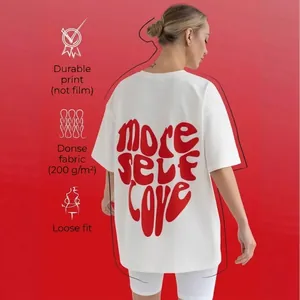 T-shirt oversize in cotone bianco con stampa cuore rosso e testo sul retro