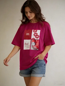Detail of rose red cotton t-shirt with retro mon cheri print and lip graphic