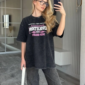 T-shirt oversize en coton noir délavé vintage avec imprimé graphique rose