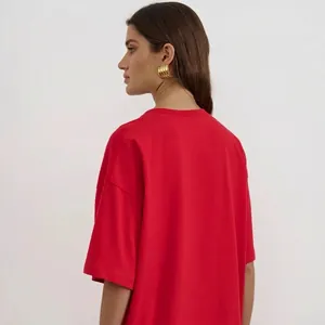 Oversized bright red cotton T-shirt with drop shoulder cut shown from a back side view