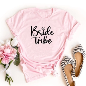 Pink cotton Bride Tribe T-shirt with diamond ring print flat lay on white background