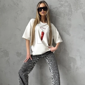 Detail view of cotton t-shirt with red chili graphic and chic leopard print pants