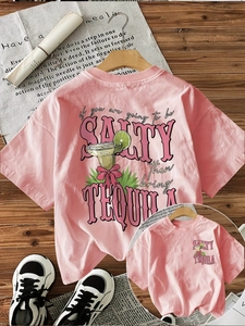 Detail of pink cotton T-shirt featuring retro tequila illustration and quote on the back