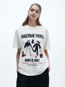 Detail of loose white cotton T-shirt featuring fashion illustration and text print