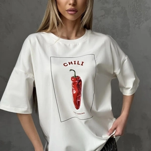 Detail shot of the cotton T-shirt featuring a red chili graphic and Just Chiling text