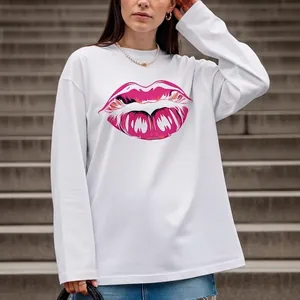 Oversized white cotton long sleeve T-shirt with pink lip print on the front