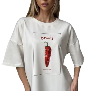 White oversized pure cotton t-shirt featuring a minimalist red chili print and text