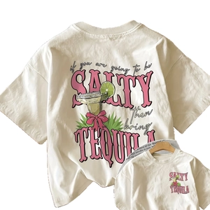Women's off-white crewneck t-shirt with artistic letter print and vacation graphics