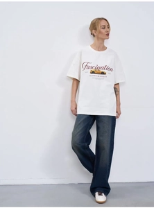 Detail of white cotton oversized T-shirt featuring a vintage yellow sports car graphic print