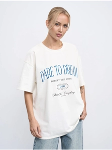 Detail of Dare to Dream blue letter print on white 100% cotton loose fit t-shirt