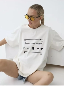 Detailed close-up of white cotton T-shirt featuring a music player graphic print