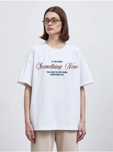 Close-up of Something New slogan print on white cotton crewneck t-shirt for women