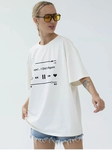 Close-up of music player print with 'ops!... I Did It Again' on white cotton t-shirt