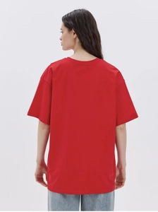 Rear view of bright red oversized cotton t-shirt featuring dropped shoulder design