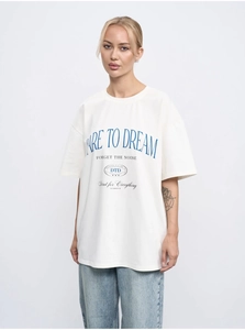 Detail of Dare to Dream lettering and logo on a loose cotton oversized T-shirt