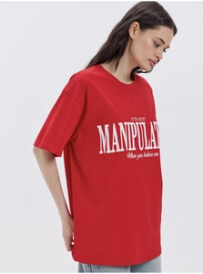 Detail of oversized red cotton t-shirt featuring artistic white text print on the chest