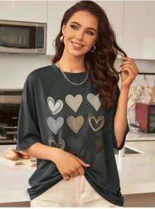 Detail of grey heart print T-shirt showing modern 3x3 matrix graphics and soft fabric texture