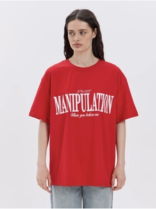Close-up of red cotton T-shirt featuring white slogan print and relaxed drop shoulders